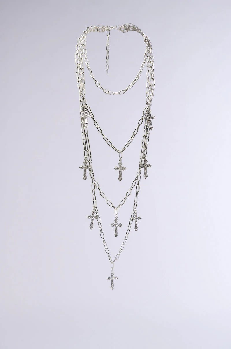 LAYERS TO THIS CROSS NECKLACE