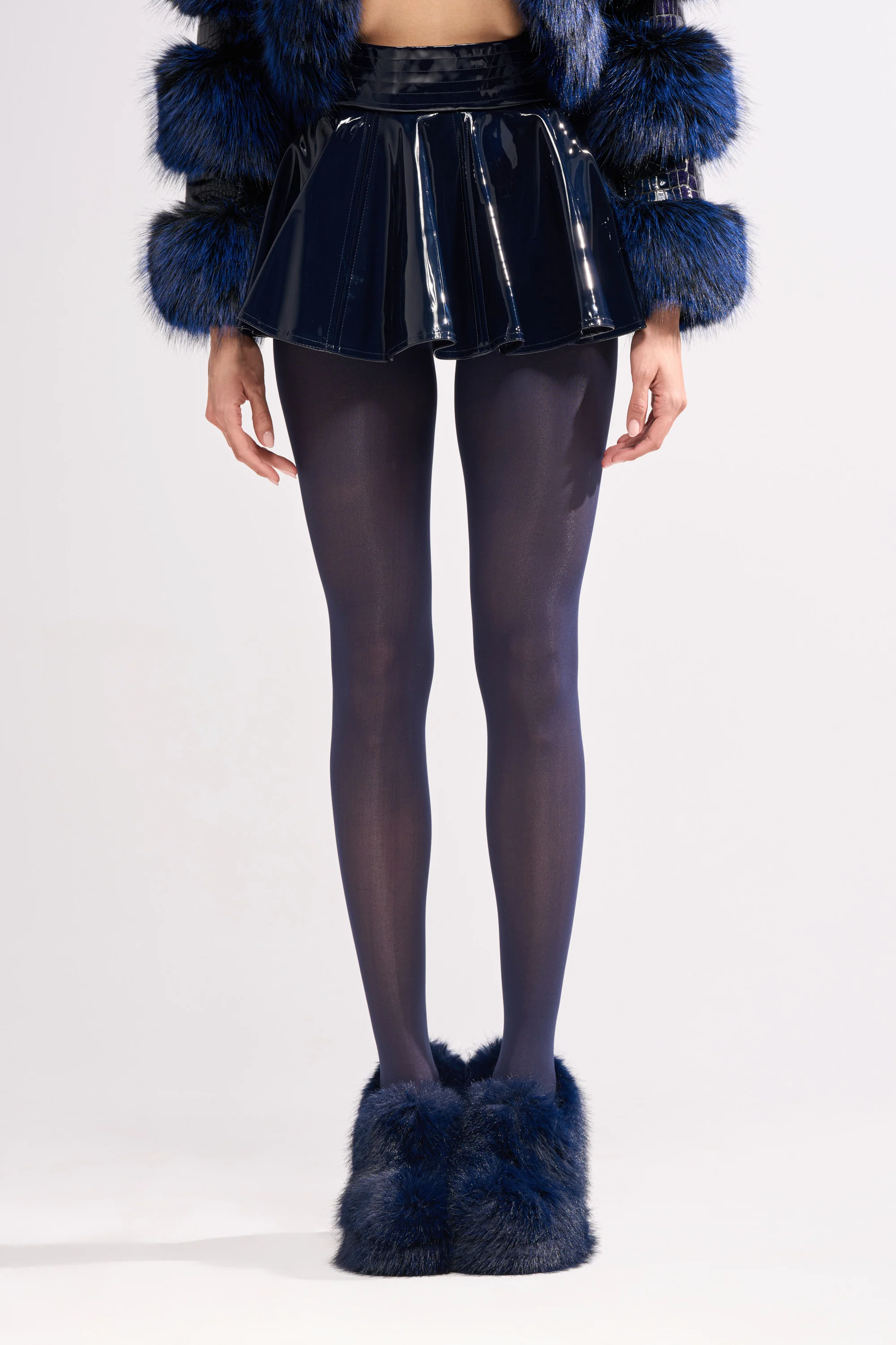 SHE IS ON FIRE FAUX LEATHER MINI SKIRT IN NAVY